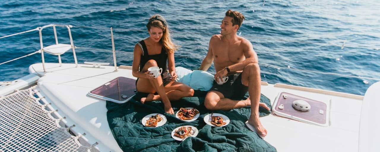 Couple enjoying a picnic on a yacht