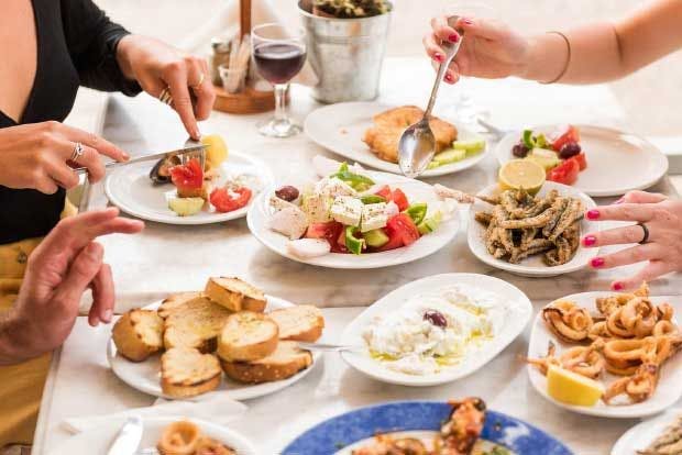 Table full of Greek mezze food