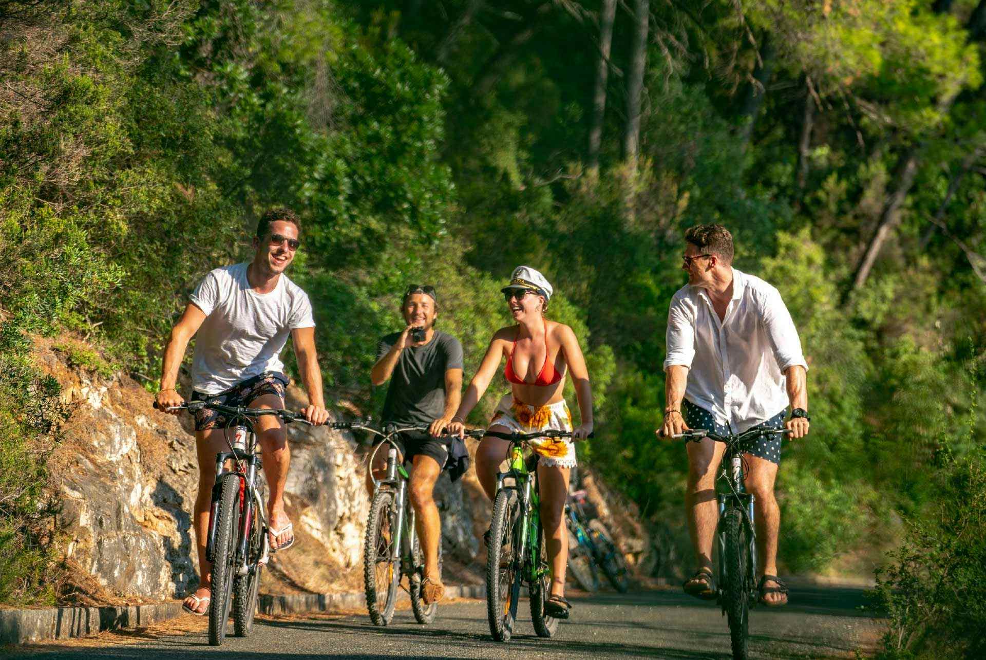 Friends ride bikes in Koufonisia