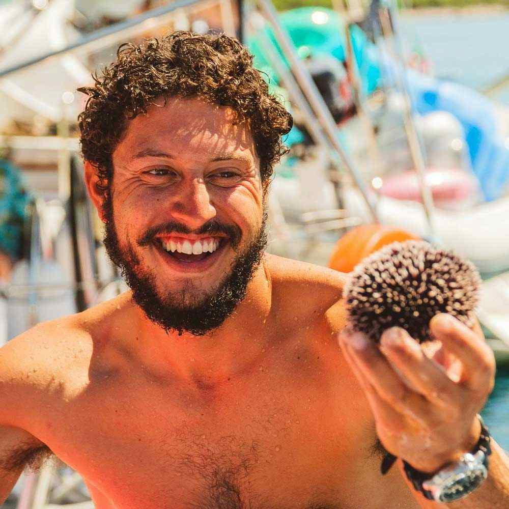 Man holding a sea urchin