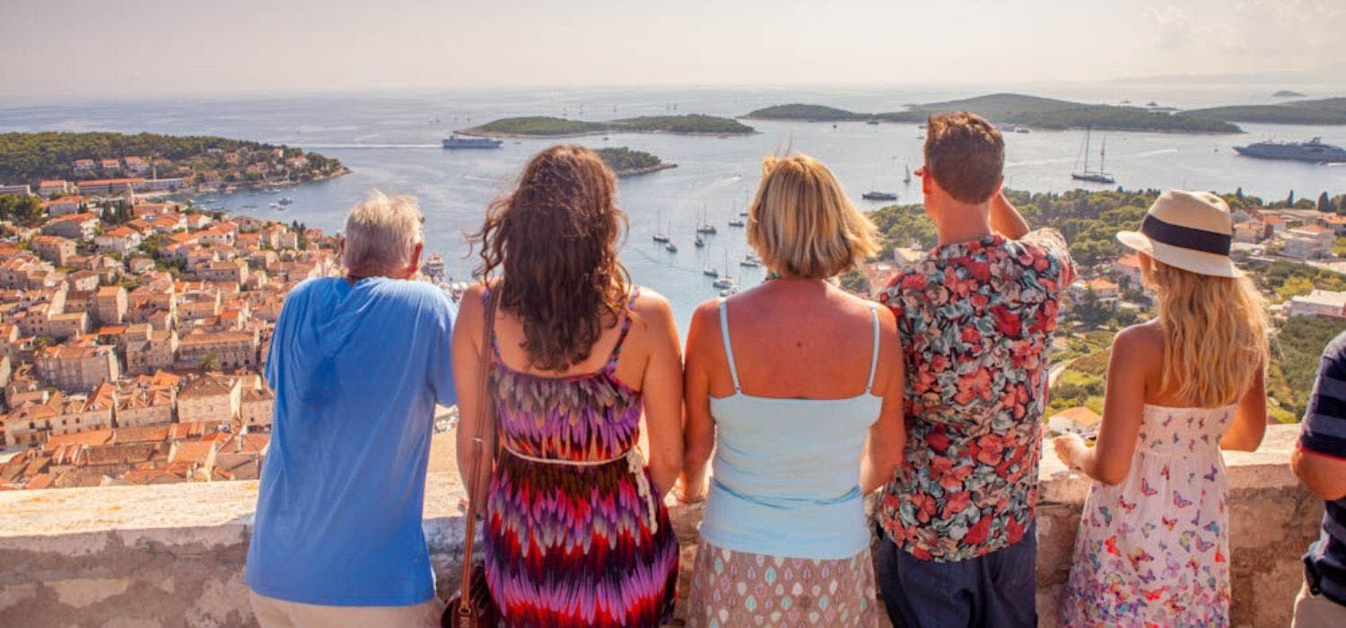 Family look out at the view over Hvar in Croatia