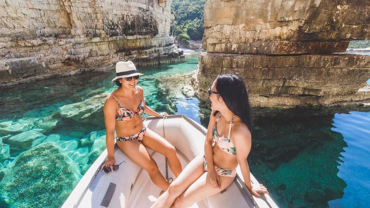Two women in inflatable boat in Greece