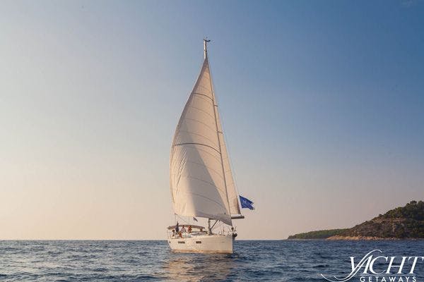 A luxury sail boat - navigating the waters during a yacht charter in Greece