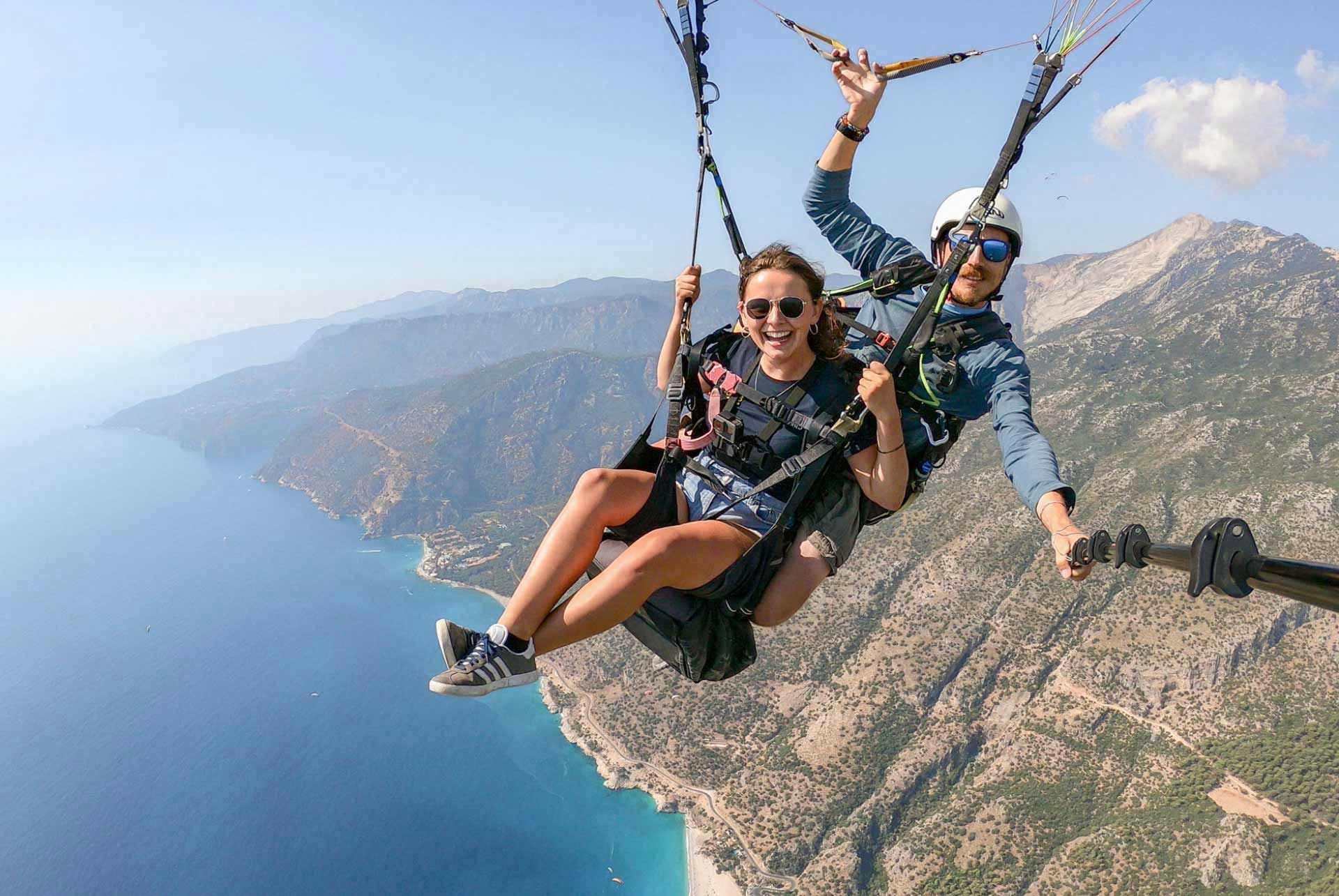 Woman tandem paragliding in Oludeniz
