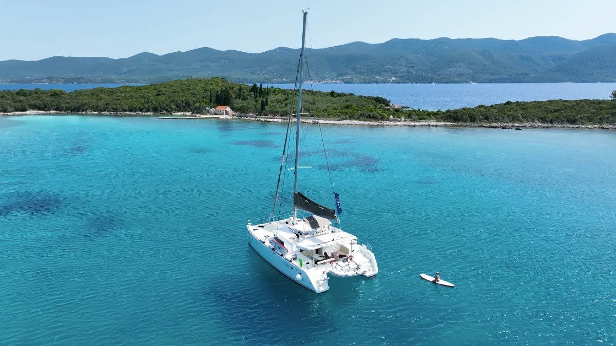 Catamaran anchored in a blue bay in Croatia