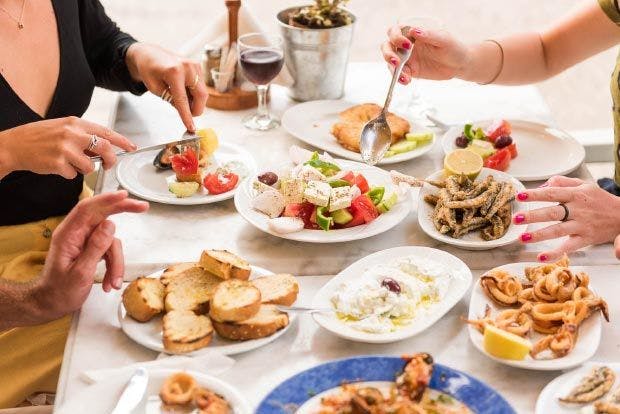 Table full of Greek food 