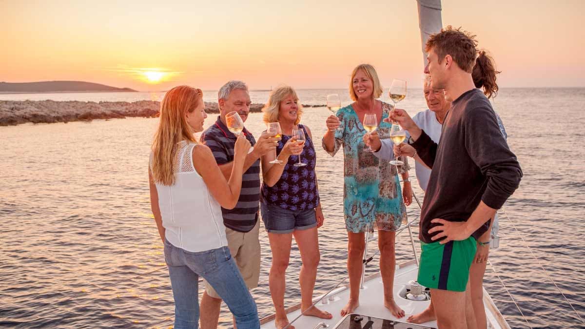 Guests enjoy sunset drinks on a Yacht Getaways yacht