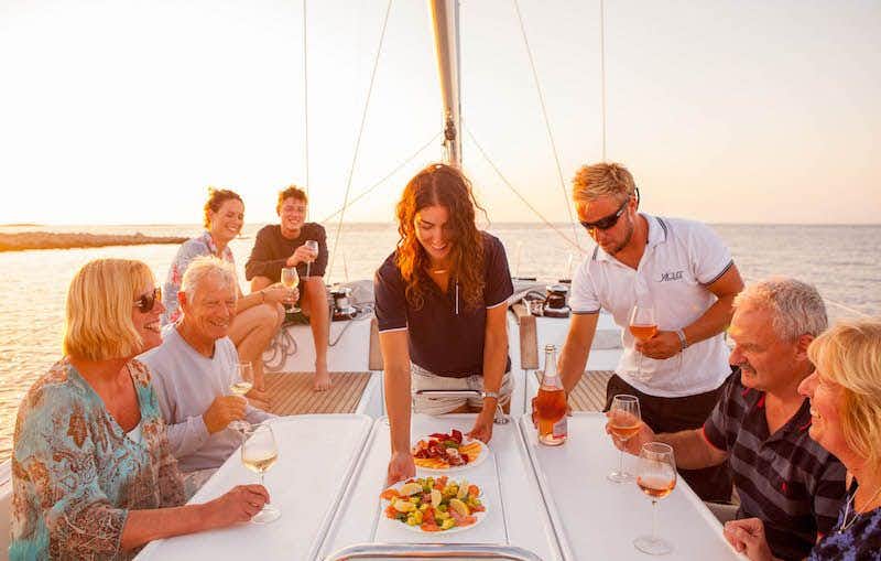 Group of people served canapés on a yacht in Croatia