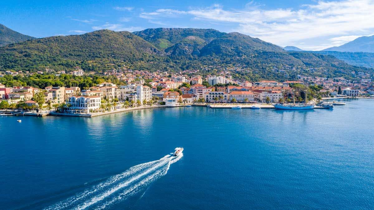 Boat cruising into Tivat town in Montenegro