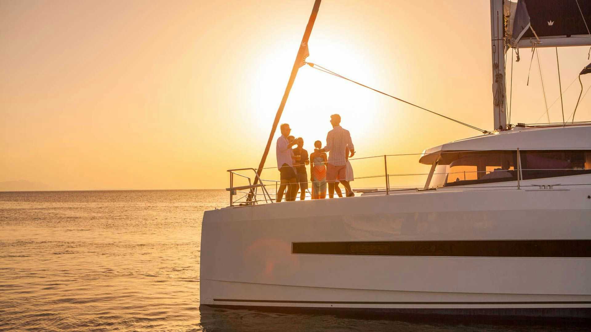 Guests having some sunset drinks on a Yacht Getaways catamaran